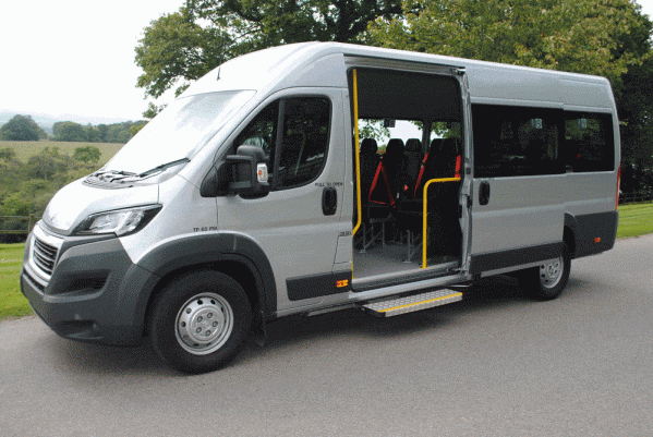 A Minibus Lite parked in a country lane with the side door open